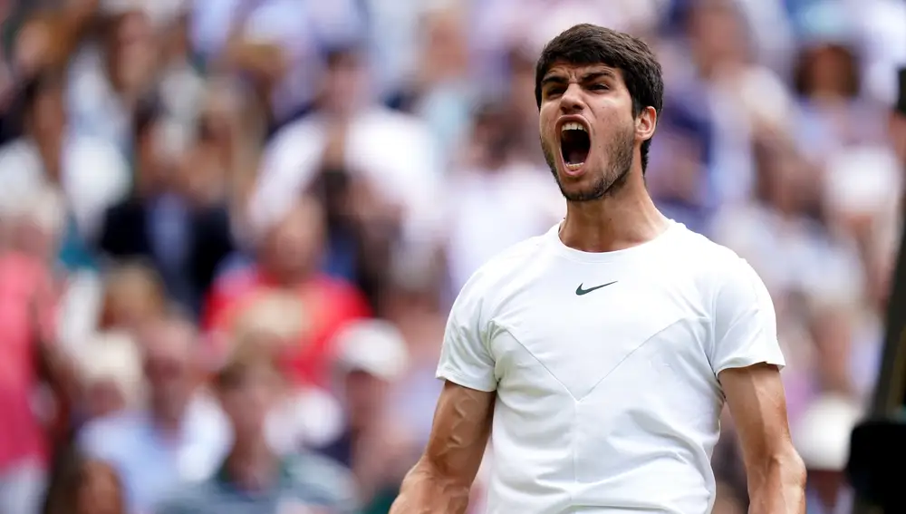 Spanish tennis player Carlos Alcaraz celebrates defeating Danish Holger Rune during their men's quarter-finals tennis match on Day Ten of the 2023 Wimbledon Championships at the All England Lawn Tennis and Croquet Club in Wimbledon.