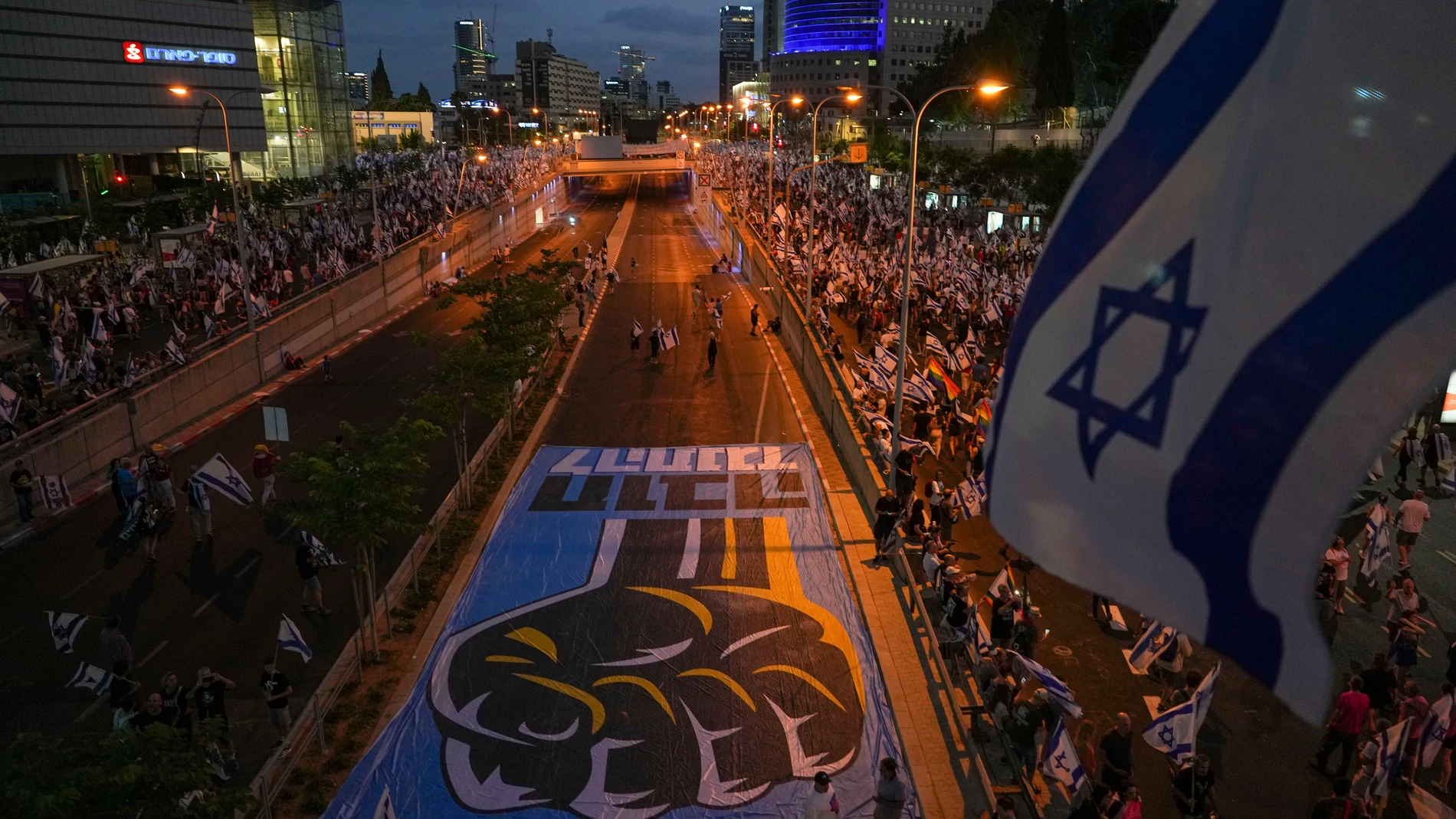 Israelis protest against plans by Prime Minister Benjamin Netanyahu's government to overhaul the judicial system in Tel Aviv, Israel, Saturday, July 29, 2023. (AP Photo/Tsafrir Abayov)