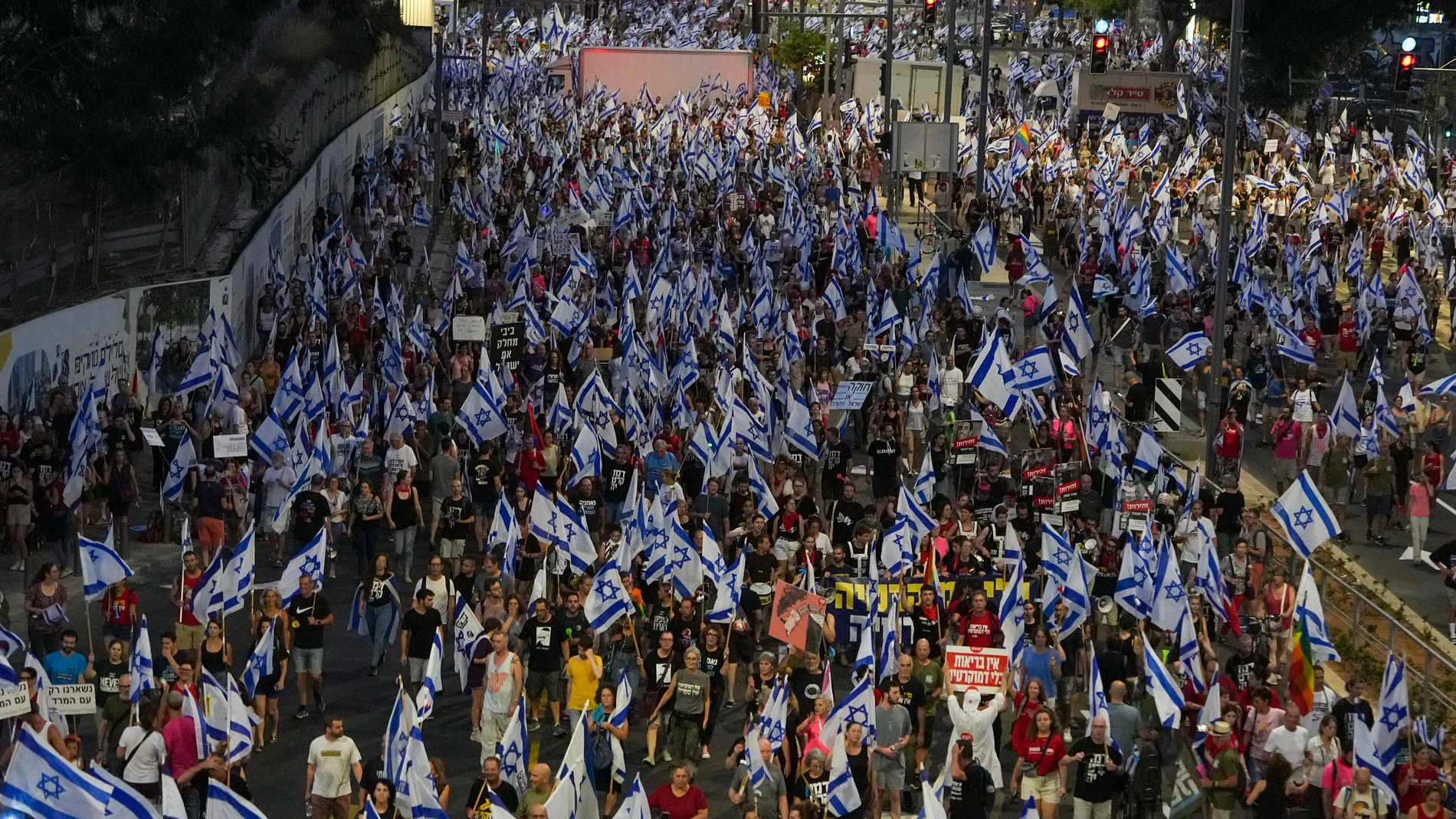 Israelis protest against plans by Prime Minister Benjamin Netanyahu's government to overhaul the judicial system in Tel Aviv, Israel, Saturday, July 29, 2023. (AP Photo/Tsafrir Abayov)