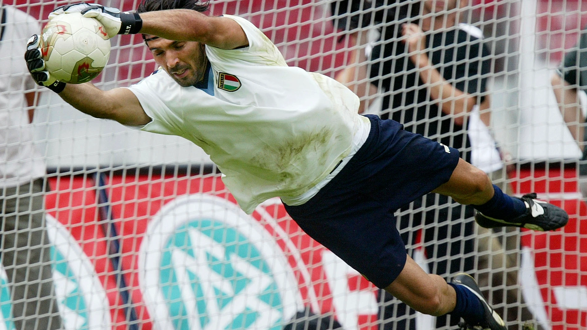 FILE - Gianluigi Buffon, goalkeeper of the Italian national soccer team, stretches for a ball during to the first training in Stuttgart, southern Germany, on Aug. 19, 2003. At age 45 and after a career that included a World Cup title with Italy, a long list of trophies with Juventus and many years when he was considered among the best goalkeepers in soccer, Gianluigi Buffon announced his retirement on Wednesday, Aug. 2, 2023. (AP Photo/Daniel Maurer)