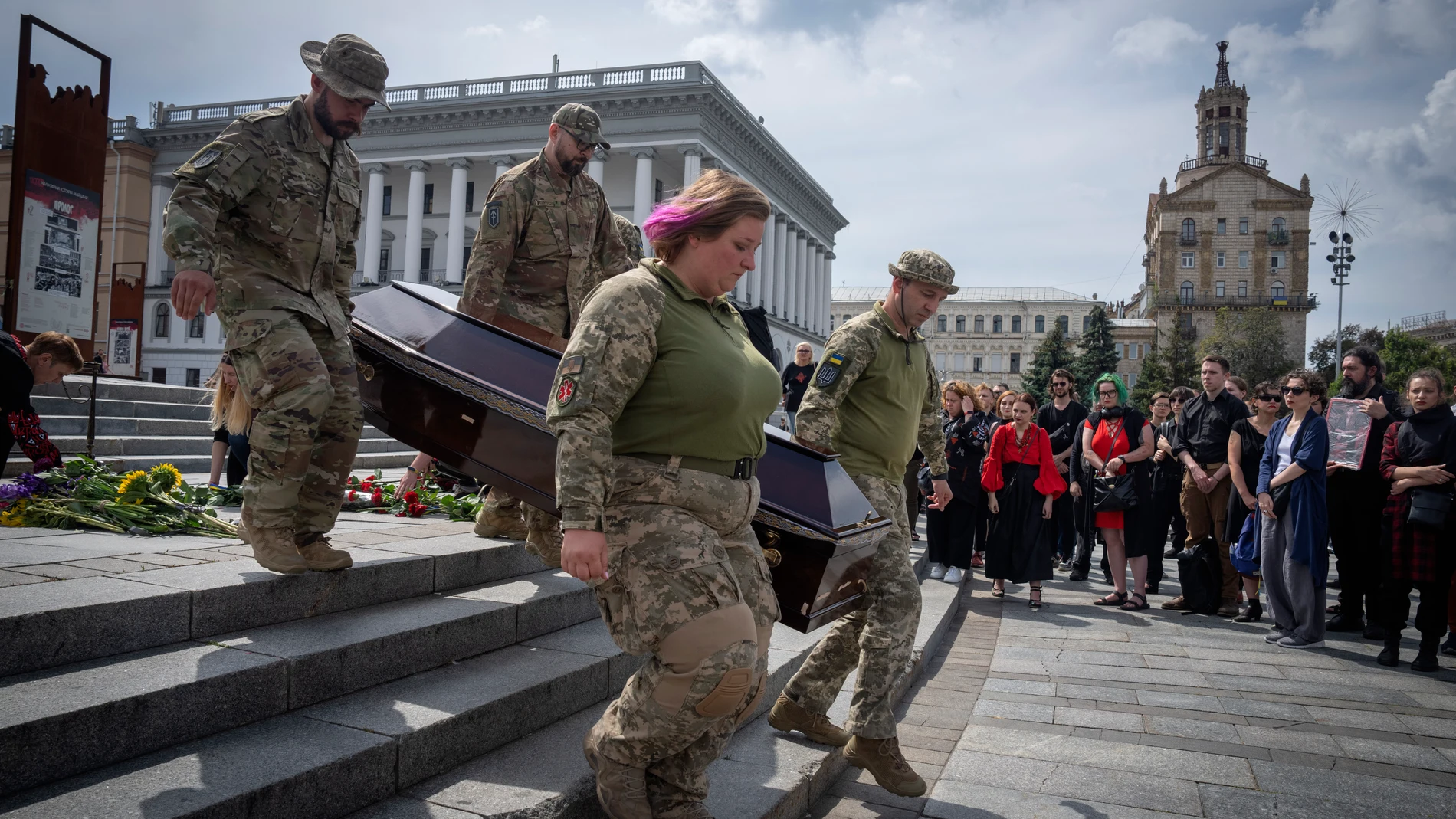 Servicemen carry a coffin of woman military medic Dariya Filipova, killed in a battle with the Russian troops, during a farewell ceremony in Independence Square in Kyiv, Ukraine, Saturday, Aug. 12, 2023. (AP Photo/Efrem Lukatsky
