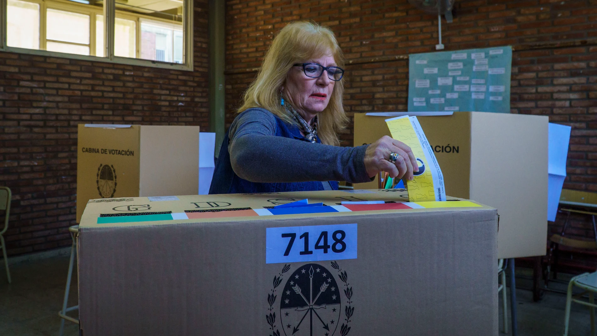 July 16, 2023, Firmat, Santa Fe, Argentina: A woman casts her vote on the primary elections (PASO)at a polling station in Firmat, Santa Fe. This election is seen as a major test for the opposing coalition Juntos por el Cambio, with Presidential candidates Horacio Rodriguez Larreta and Patricia Bullrich supporting two candidates for Governor, Maximiliano Pullaro and Carolina Losada respectively, that have engaged in a battle that escalated to the point of accusing Pullaro of complicity with dr...