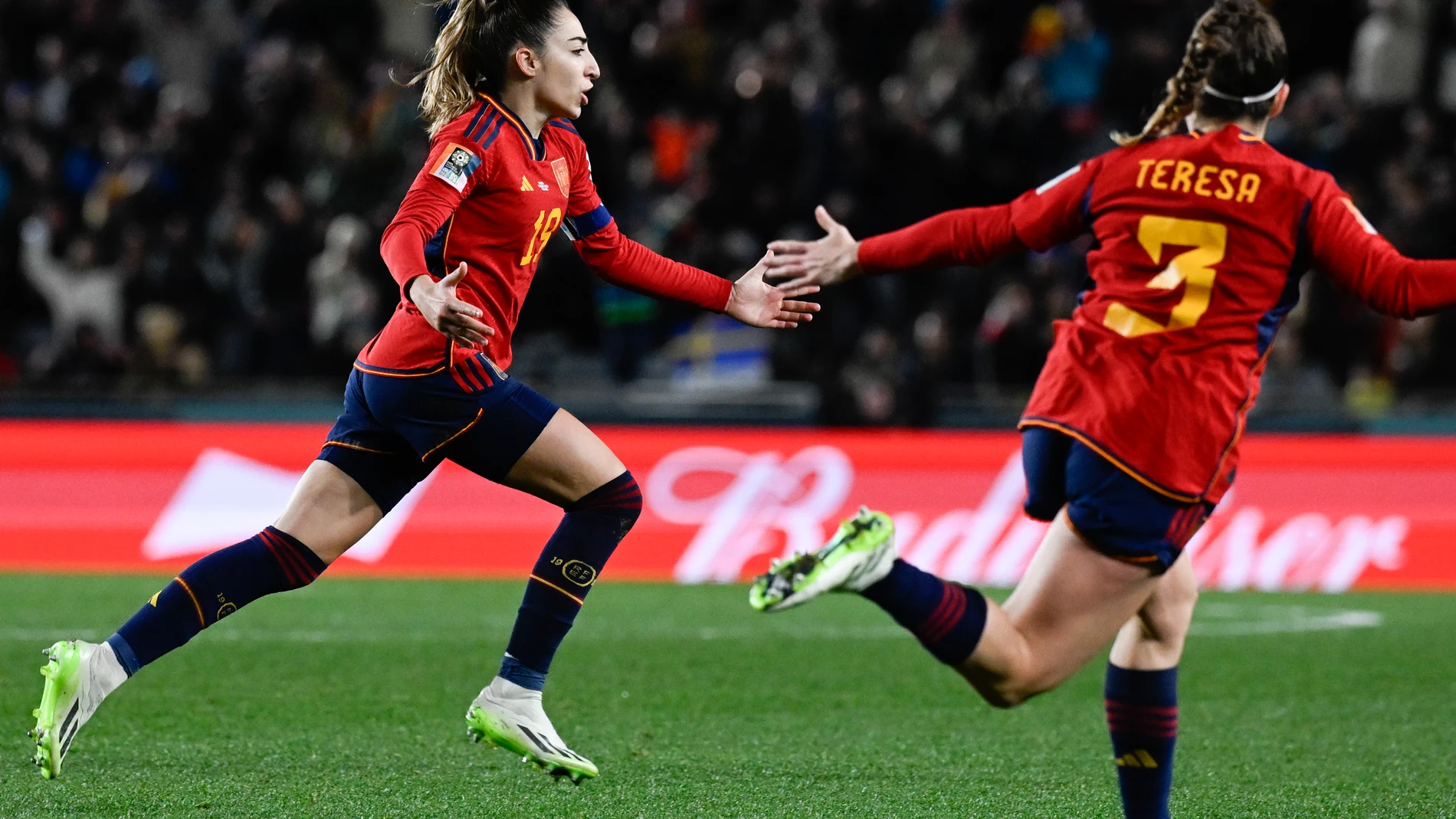Spain's Olga Carmona, left, reacts after scoring her team's second goal during the Women's World Cup semifinal soccer match between Sweden and Spain at Eden Park in Auckland, New Zealand, Tuesday, Aug. 15, 2023. (AP Photo/Andrew Cornaga)