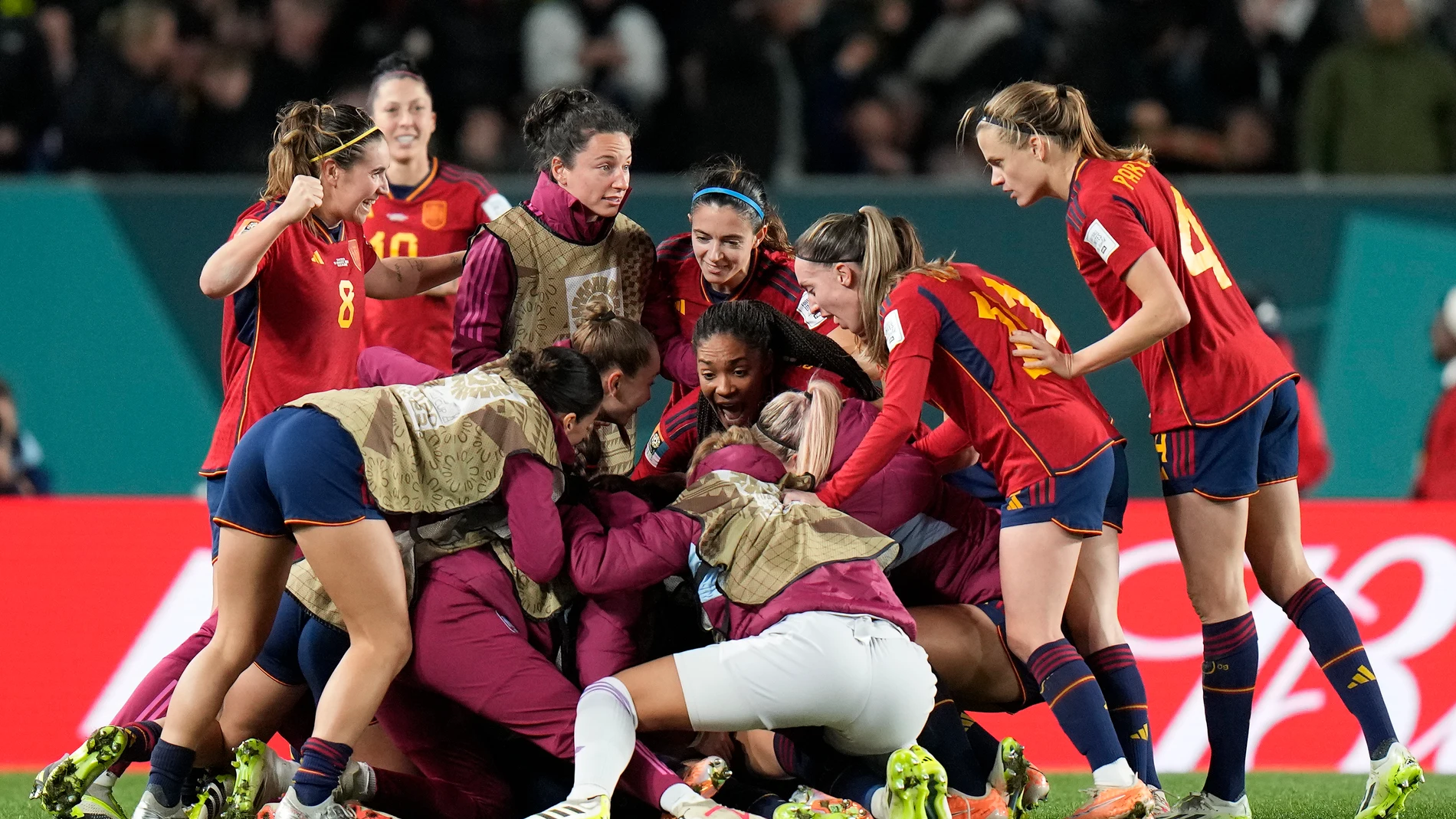 Spain's Olga Carmona is celebrates by her teammates after she scored her side's winning goal during the Women's World Cup semifinal soccer match between Sweden and Spain at Eden Park in Auckland, New Zealand, Tuesday, Aug. 15, 2023. (AP Photo/Alessandra Tarantino)