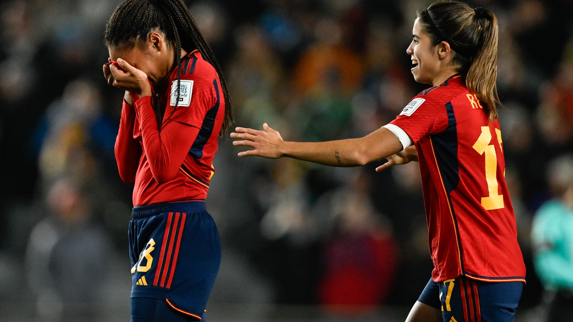 Spain's Salma Paralluelo, left, reacts with a teammate Alba Redondo after defeating Sweden in the Women's World Cup semifinal soccer match at Eden Park in Auckland, New Zealand, Tuesday, Aug. 15, 2023. (AP Photo/Andrew Cornaga)