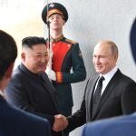 Russian President Vladimir Putin welcomes North Korean leader Kim Jong Un prior to their talks at the Far Eastern Federal University campus on Russky island in the far-eastern Russian port of Vladivostok on April 25, 2019. 