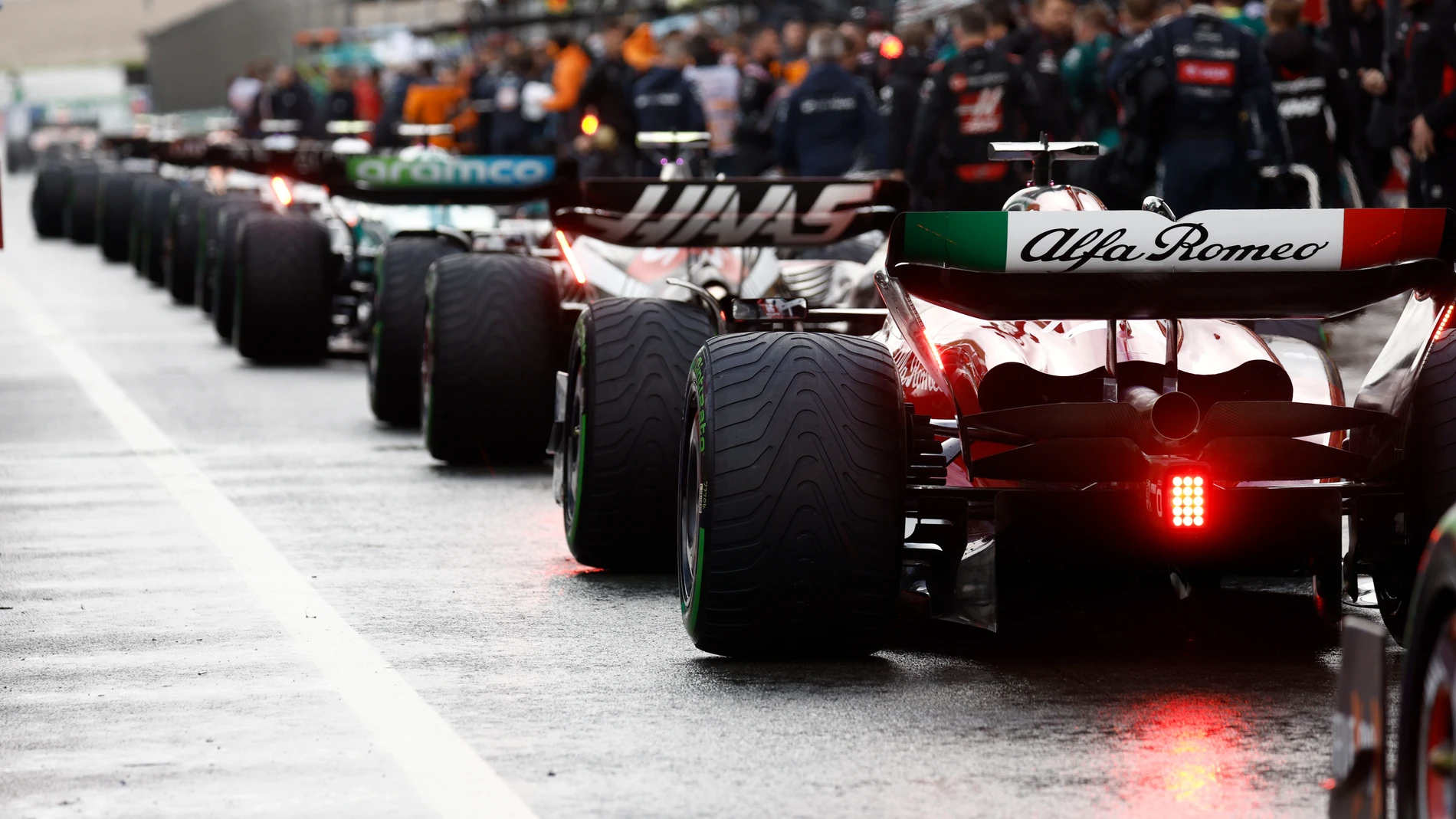Cars line up after a break due to heavy rain during the Formula One Dutch Grand Prix , at the Zandvoort racetrack, in Zandvoort, Netherlands, Sunday, Aug. 27, 2023. (Simon Wohlfart/Pool via AP)