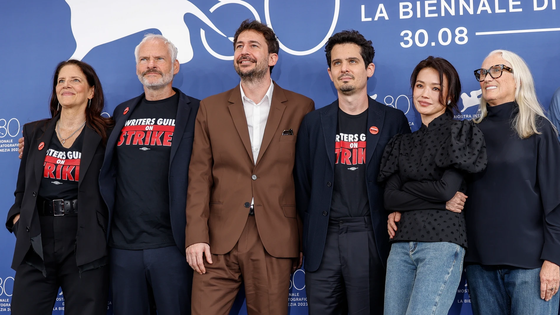 Jury members Laura Poitras, from left, Martin McDonagh, Santiago Mitre, jury president Damien Chazelle, Shu Qi and Jane Campion pose for photographers during the photo call for the Jury during the 80th edition of the Venice Film Festival in Venice, Italy, on Wednesday, Aug. 30, 2023. (Photo by Vianney Le Caer/Invision/AP)