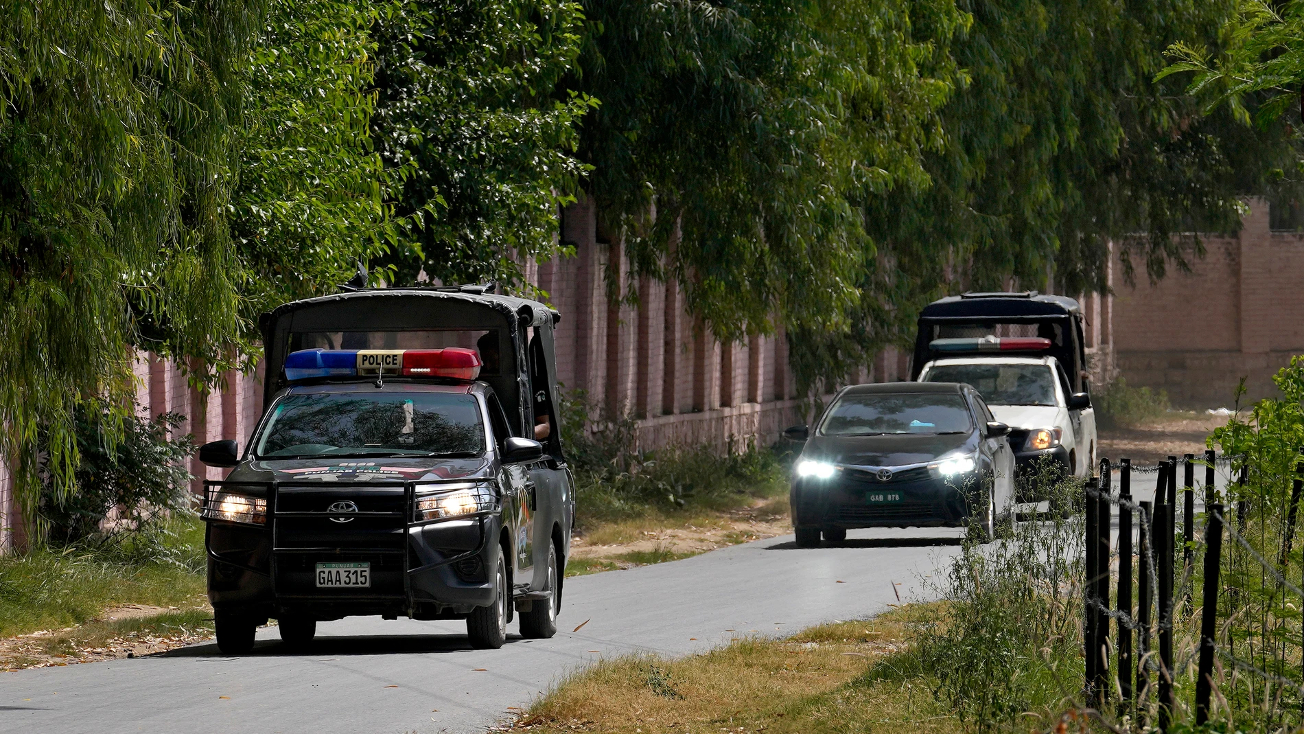 A police squad escort a car carrying a judge of special court leaving after a case hearing of Pakistan's former Prime Minister Imran Khan at the District Jail, in Attock, Pakistan, Wednesday, Aug. 30, 2023. A court asked the official in charge of the Attock prison to keep former Prime Minister Khan there until at least Wednesday, when Khan is expected to face a hearing on charges of "exposing an official secret document" in an incident last year when he waved a confidential diplomatic letter ...