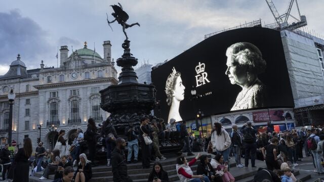 A tribute to the Queen is displayed on a giant screen at Piccadilly Circus in London, Sept. 9, 2022. Because she reigned and lived for so long, Queen Elizabeth II's death was a reminder that mortality and the march of time are inexorable. 