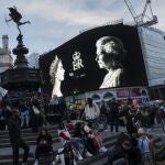A tribute to the Queen is displayed on a giant screen at Piccadilly Circus in London, Sept. 9, 2022. Because she reigned and lived for so long, Queen Elizabeth II's death was a reminder that mortality and the march of time are inexorable. 