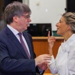 Member of the European Parliament Carles Puigdemont (L) and Spanish Second Deputy Prime Minister and Sumar party leader Yolanda Diaz speak in Brussels, Belgium, 04 September 2023. 