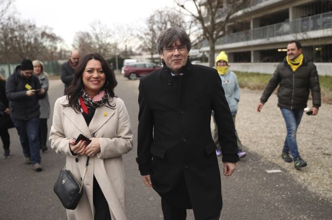 Catalonia's former regional president Carles Puigdemont, center right, and his wife Marcela Topor, center left, arrives at the European Parliament in Strasbourg, eastern France.