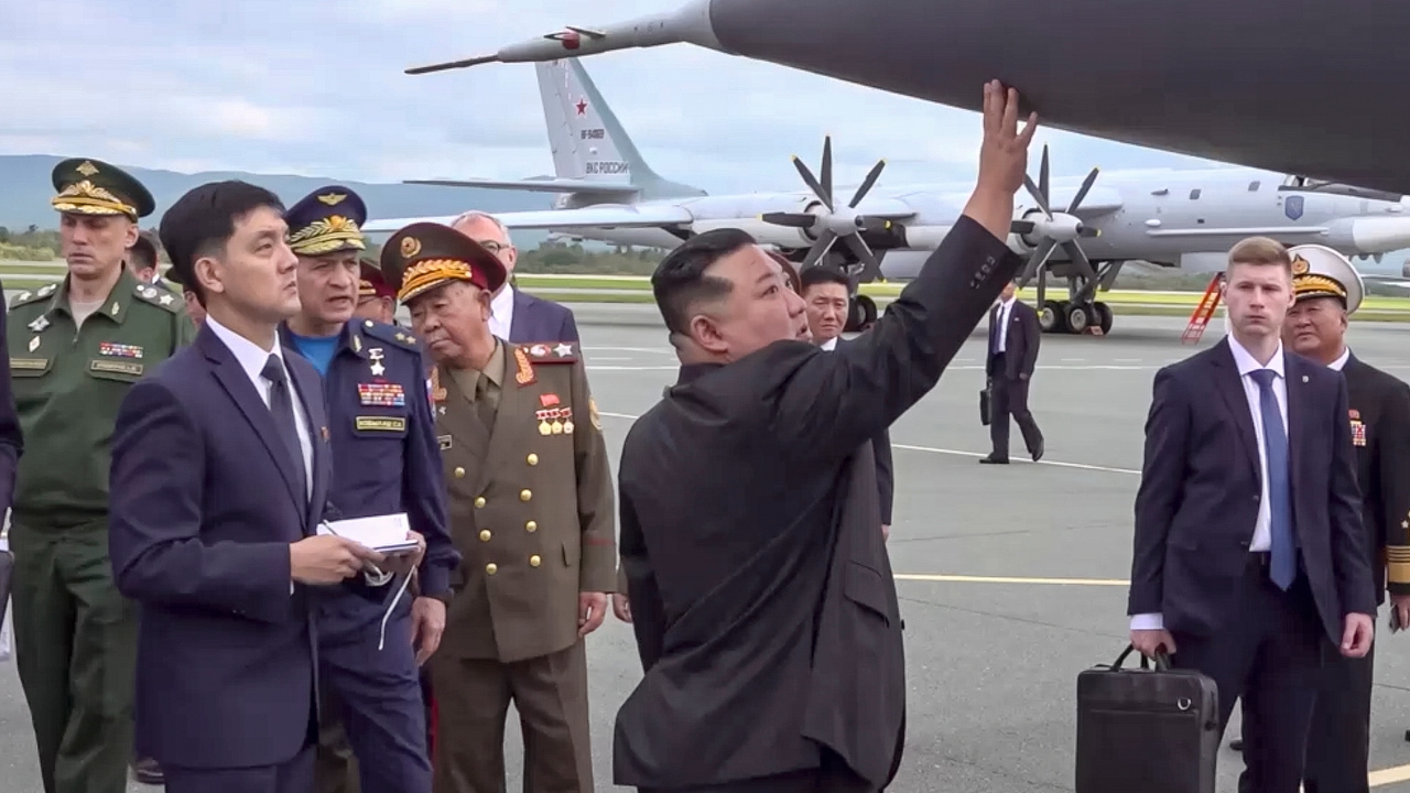 Who is the young North Korean who is always behind Kim during his visit to Russia?