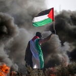 Clashes erupt between Palestinians and Israeli troops at Gaza Strip border