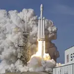 A Falcon 9 SpaceX heavy rocket lifts off from pad 39A at the Kennedy Space Center in Cape Canaveral, Fla.