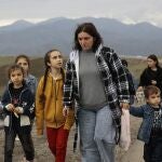 Ethnic Armenians fleeing Nagorno-Karabakh walk on a road to Kornidzor, in Armenia's Syunik region