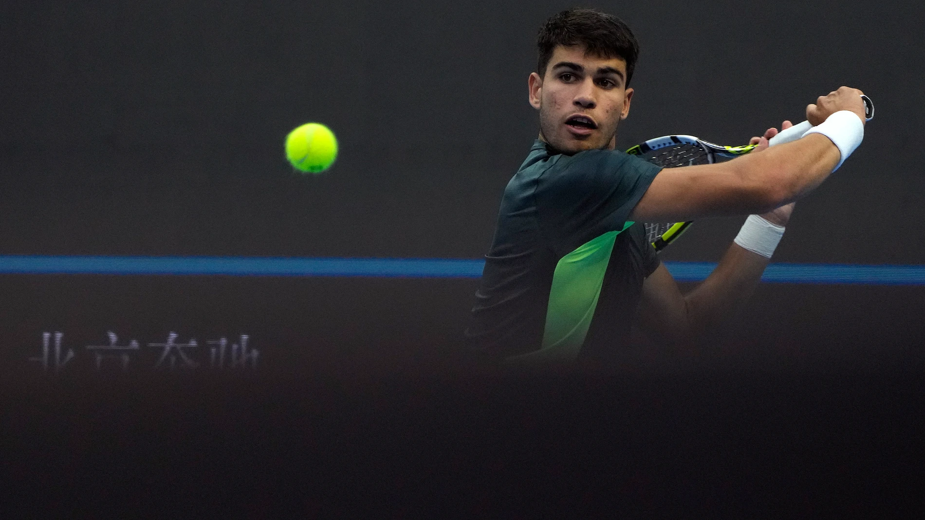 Carlos Alcaraz of Spain prepares to hit a return shot against Lorenzo Musetti of Italy during the second round of the men's singles in the China Open tennis tournament at the Diamond Court in Beijing, Sunday, Oct. 1, 2023. (AP Photo/Andy Wong)