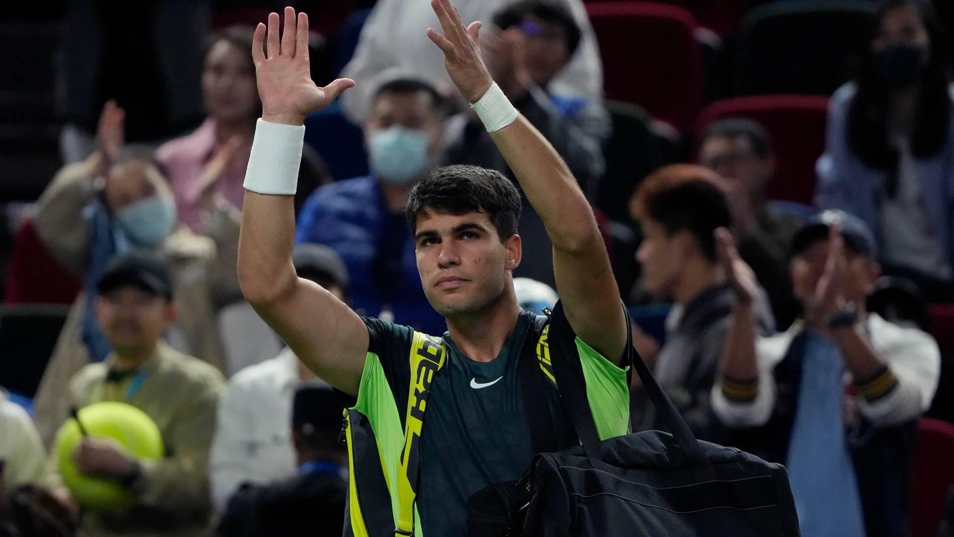 Carlos Alcaraz of Spain gestures as he leaves the court after defeated by Grigor Dimitrov of Bulgaria in the 4th round of the men's singles match in the Shanghai Masters tennis tournament at Qizhong Forest Sports City Tennis Center in Shanghai, China, Wednesday, Oct. 11, 2023. (AP Photo/Andy Wong)