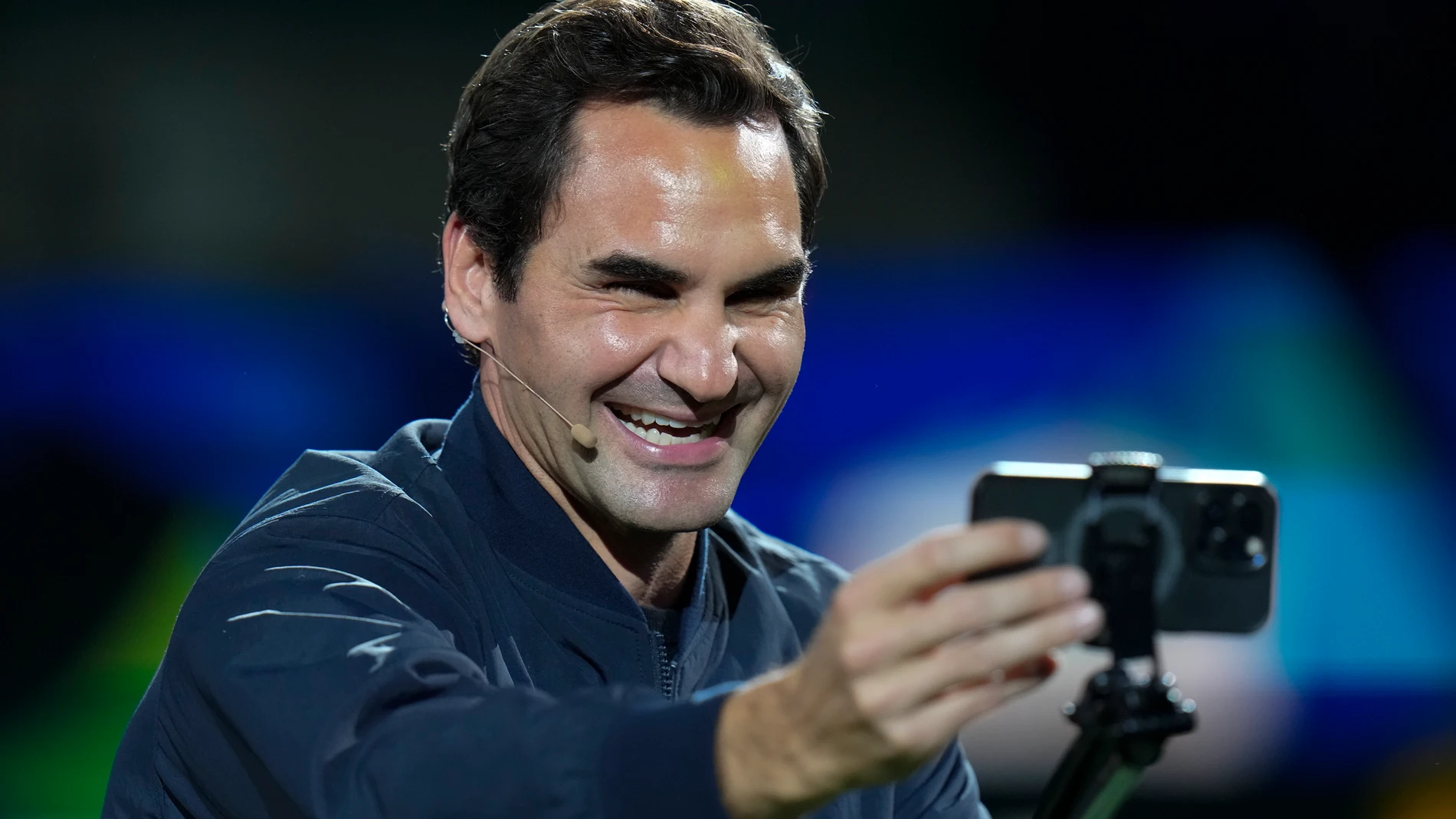 Retired tennis player Roger Federer takes a selfie with spectators during a Federer's fan day, a side event of the Shanghai Masters tennis tournament at Qizhong Forest Sports City Tennis Center in Shanghai, China, Friday, Oct. 13, 2023. (AP Photo/Andy Wong)