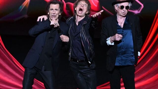 Ron Wood, Mick Jagger and Keith Richards of legendary British rock band, The Rolling Stones pose on stage during a launch event for their new album, "Hackney Diamonds" at Hackney Empire in London