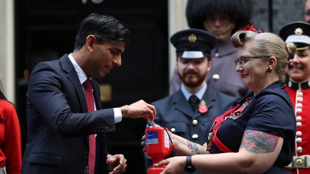 Britain'Äôs Prime Minister Rishi Sunak buys a poppy to support Armed Forces community