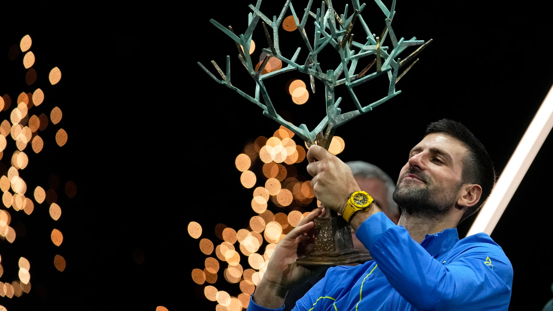 Serbia's Novak Djokovic holds up the trophy after winning the final match against Bulgaria's Grigor Dimitrov at the Paris Masters tennis tournament Sunday, Nov. 5, 2023. (AP Photo/Michel Euler)