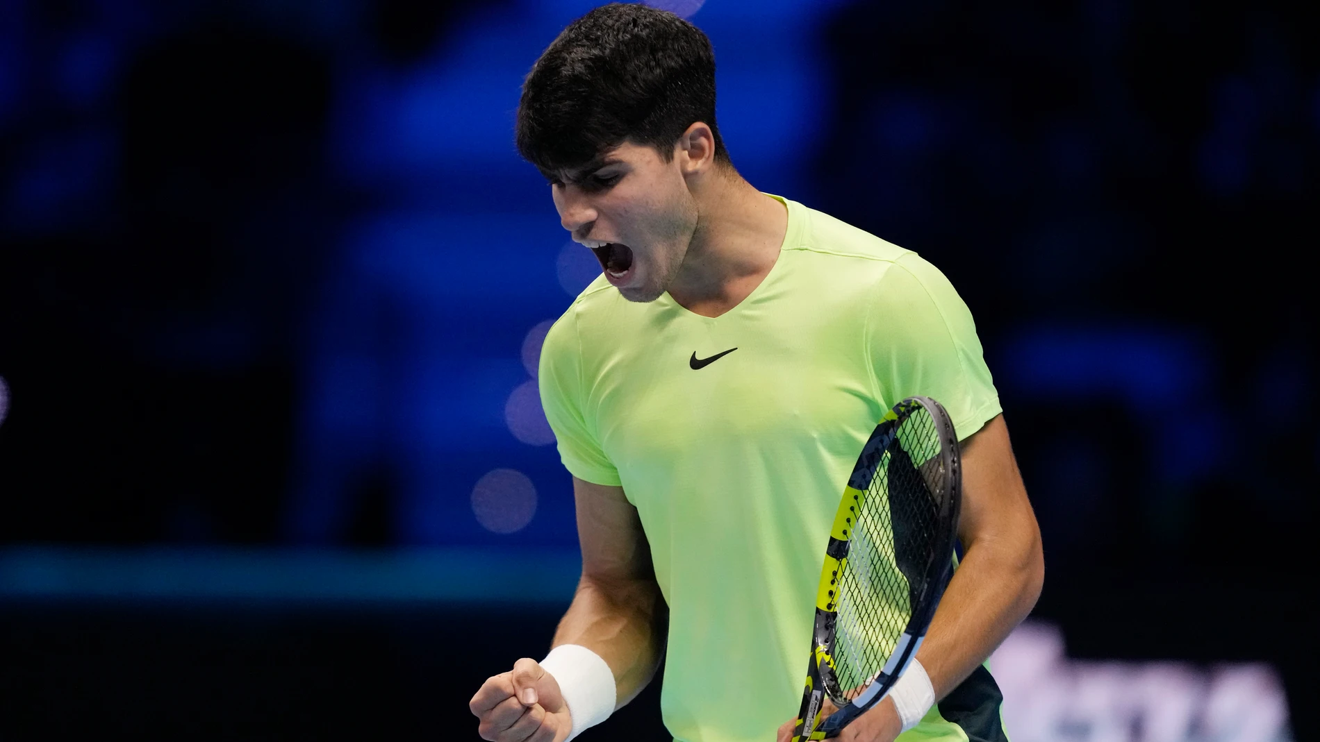 Spain's Carlos Alcaraz reacts during the singles tennis match against Germany's Alexander Zverev, of the ATP World Tour Finals at the Pala Alpitour, in Turin, Italy, Monday, Nov. 13, 2023. (AP Photo/Antonio Calanni)