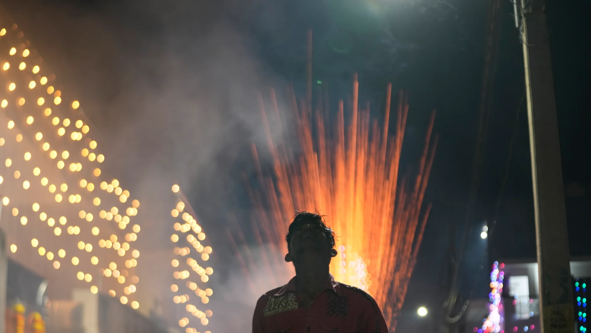 Indians light firecrackers during festival of lights Diwali in Jammu, India, Sunday, Nov.12, 2023. (AP Photo/Channi Anand)