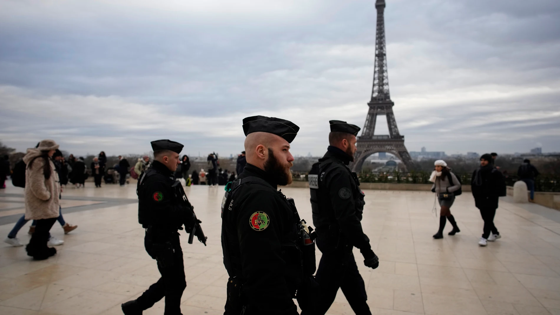 French gendarmes patrol the Trocadero plaza near the Eiffel Tower after a man targeted passersbys late saturday, killing a German tourist with a knife and injuring two others in Paris, Sunday, Dec. 3, 2023. Police subdued the man, a 25-year-old French citizen who had spent four years in prison for a violent offense. After his arrest, he expressed anguish about Muslims dying, notably in the Palestinian territories. (AP Photo/Christophe Ena)