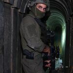 A soldier stands in what the Israeli army says is a tunnel dug by Hamas militants inside the Al-Shifa hospital complex in Gaza City in the northern Gaza Strip, amid continuing battles between Israel and the Palestinian militant group Hamas.