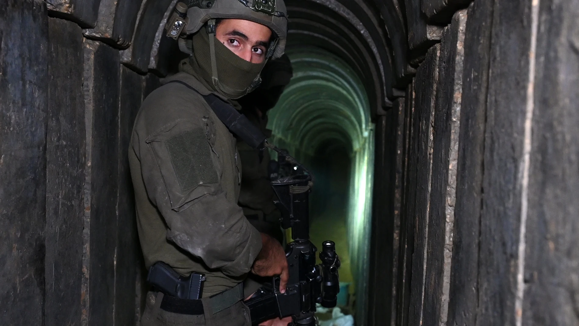 A soldier stands in what the Israeli army says is a tunnel dug by Hamas militants inside the Al-Shifa hospital complex in Gaza City in the northern Gaza Strip, amid continuing battles between Israel and the Palestinian militant group Hamas.