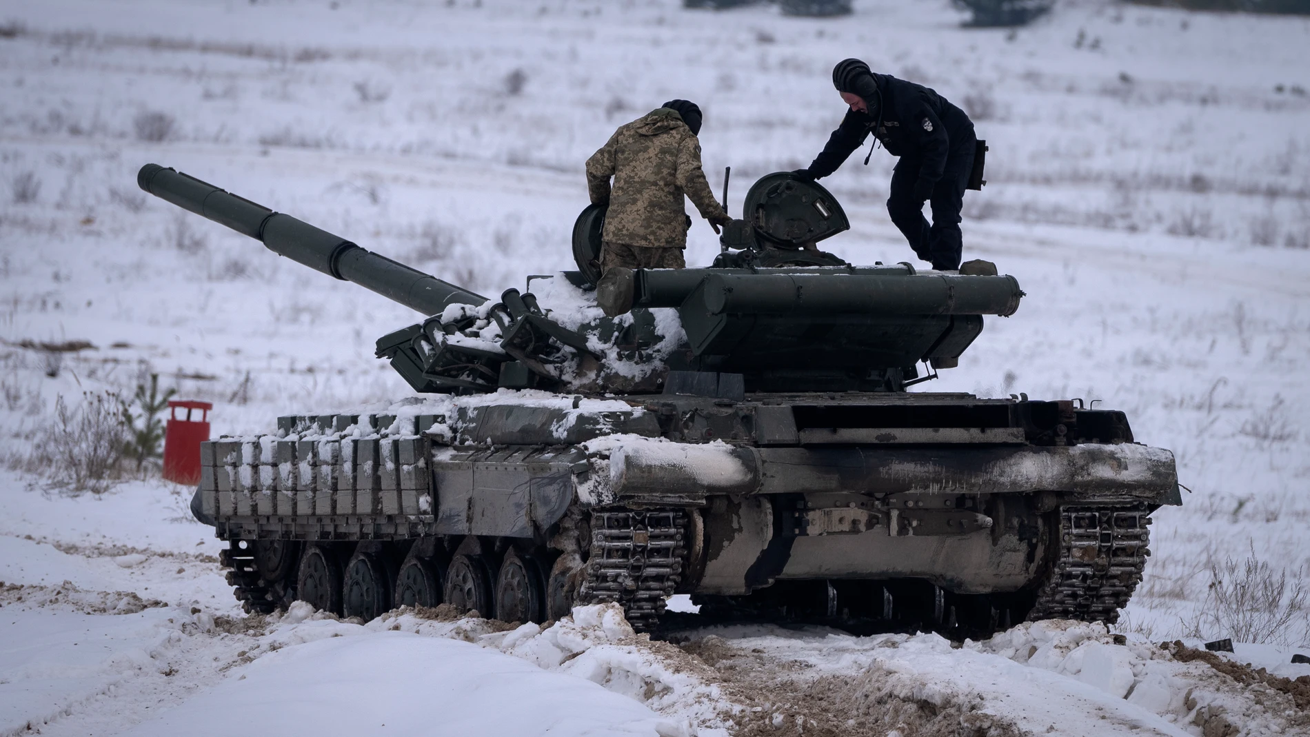 Ukrainian soldiers practice on a tank during military training in Ukraine Wednesday, Dec. 6, 2023. (AP Photo/Efrem Lukatsky)