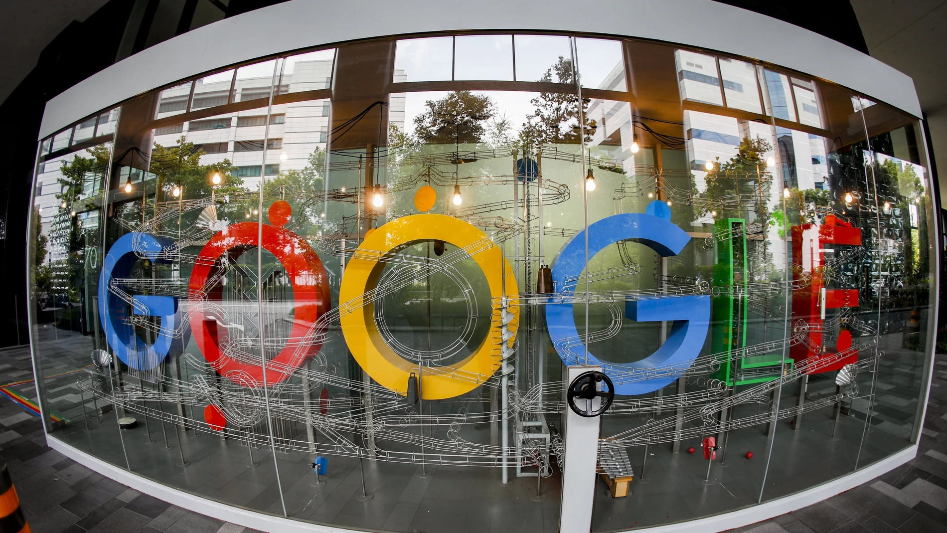 A picture made with a fisheye lens shows the Google logo.