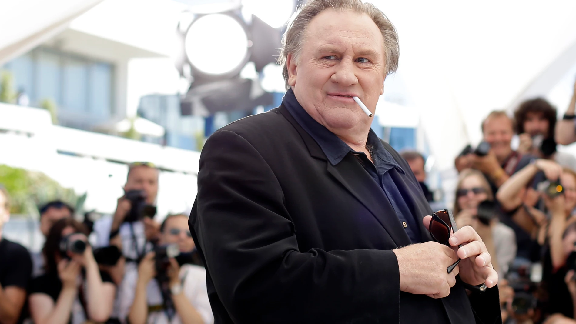 FILE - Actor Gerard Depardieu poses for photographers during a photo call for the film Valley of Love, at the 68th international film festival, Cannes, southern France, Friday, May 22, 2015. The Grevin Museum of waxworks in Paris has removed the wax figure of French actor Gerard Depardieu due to negative reactions from visitors, the museum said Monday. (AP Photo/Thibault Camus, File)