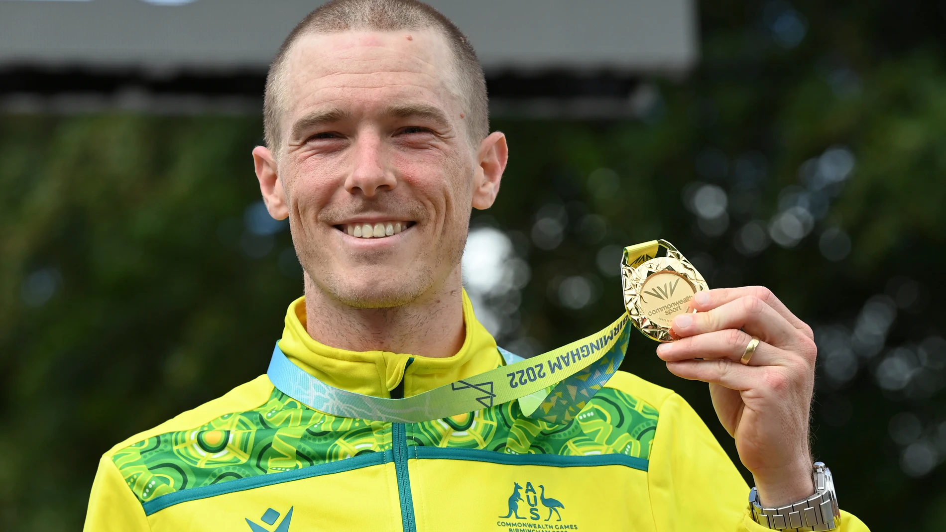 FILE - Gold medal winner Rohan Dennis of Australia poses with his medal after the men's cycling individual time trials at the Commonwealth Games in West Park, Wolverhampton, England, on Aug. 4, 2022. Dennis was reported to have been charged in connection with the death of his wife, Olympic cyclist Melissa Hoskins, who died after being struck by a vehicle while riding in Adelaide. (AP Photo/Rui Vieira, File)