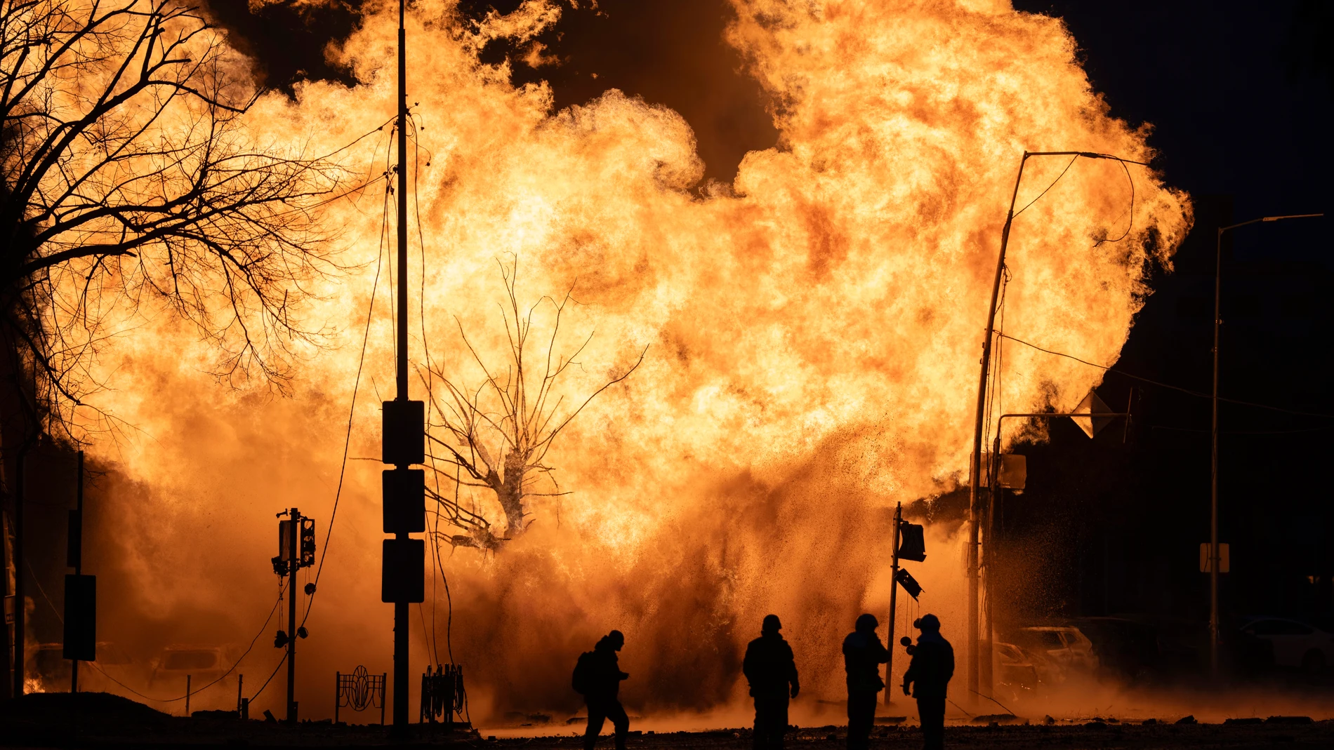Firefighters work to extinguish a fire after a Russian attack in Kyiv, Ukraine, Tuesday, Jan. 2, 2024. (AP Photo/Efrem Lukatsky)