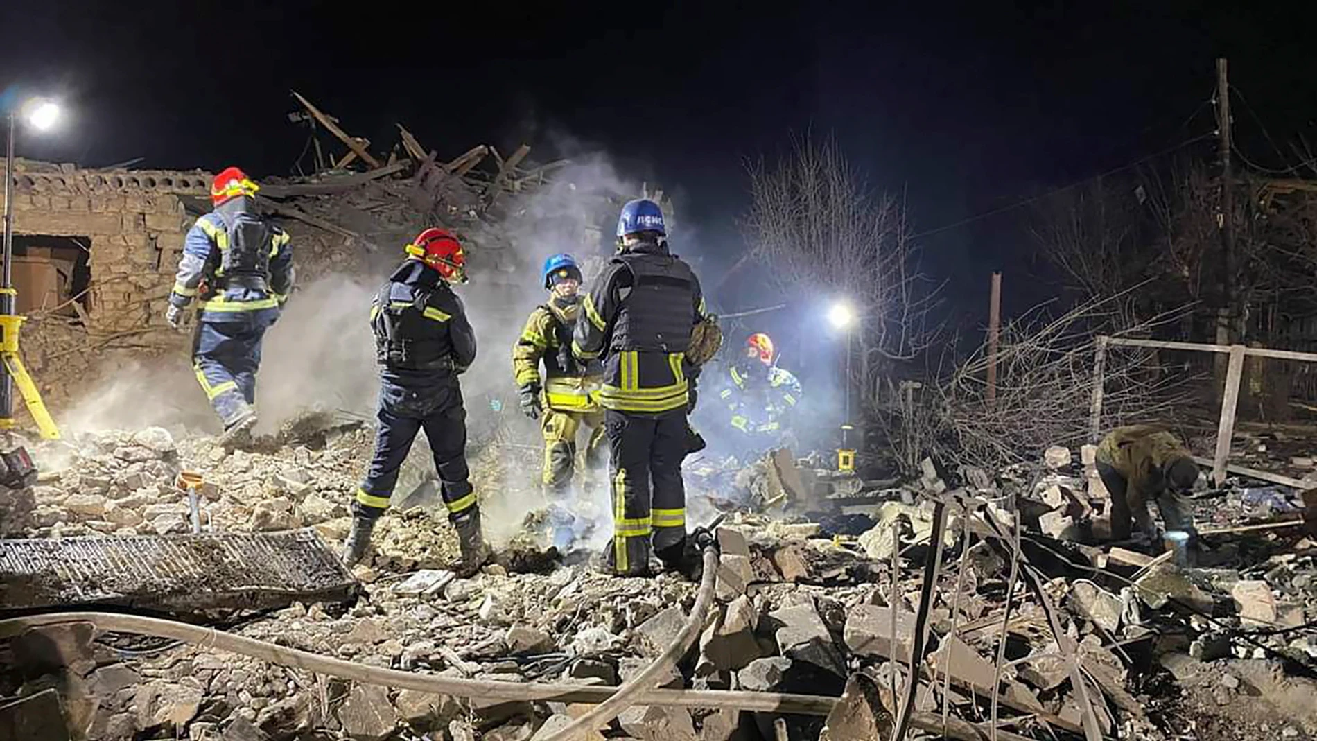 Pokrovsk (Ukraine), 06/01/2024.- A handout photo released by the press service of the State Emergency Service (SES) of Ukraine shows Ukrainian rescuers working at the site of a missile attack in the Pokrovsky district, Donetsk region, eastern Ukraine, 06 January 2024, amid the Russian invasion. At least 11 people, including five children, were killed after Russian forces fired 'S-300' missiles at the Pokrovsky district in the Donetsk region, the head of the Donetsk Regional Military Administr...