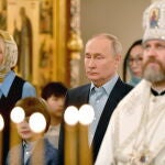 Russian President Vladimir Putin attends a Christmas service