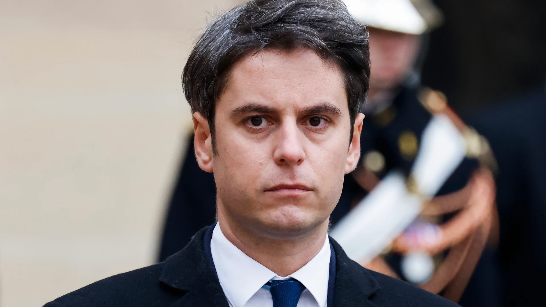 Paris (France), 09/01/2024.- New French Prime Minister Gabriel Attal listens to outgoing prime minister's speech in the courtyard of the Matignon Hotel during the handover ceremony in Paris, France, 09 January 2024. French Minister for National Education and Youth Gabriel Attal has been named France's new Prime Minister following the resignation of previous Prime Minister Elisabeth Borne on the evening of 08 January 2024. Gabriel Attal became France's youngest prime minister at 34 years old. ...