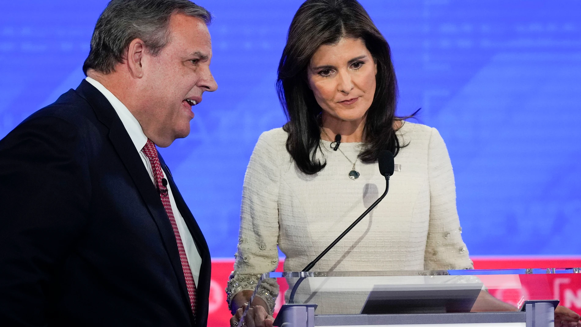 FILE - Republican presidential candidates former New Jersey Gov. Chris Christie, left, talking with former U.N. Ambassador Nikki Haley, right, during a commercial break at a Republican presidential primary debate hosted by NewsNation, Dec. 6, 2023, at the Moody Music Hall at the University of Alabama in Tuscaloosa, Ala. (AP Photo/Gerald Herbert, File)