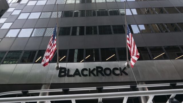 Flags fly on the front of BlackRock headquarters, Wednesday, Jan. 13, 2021, in New York.