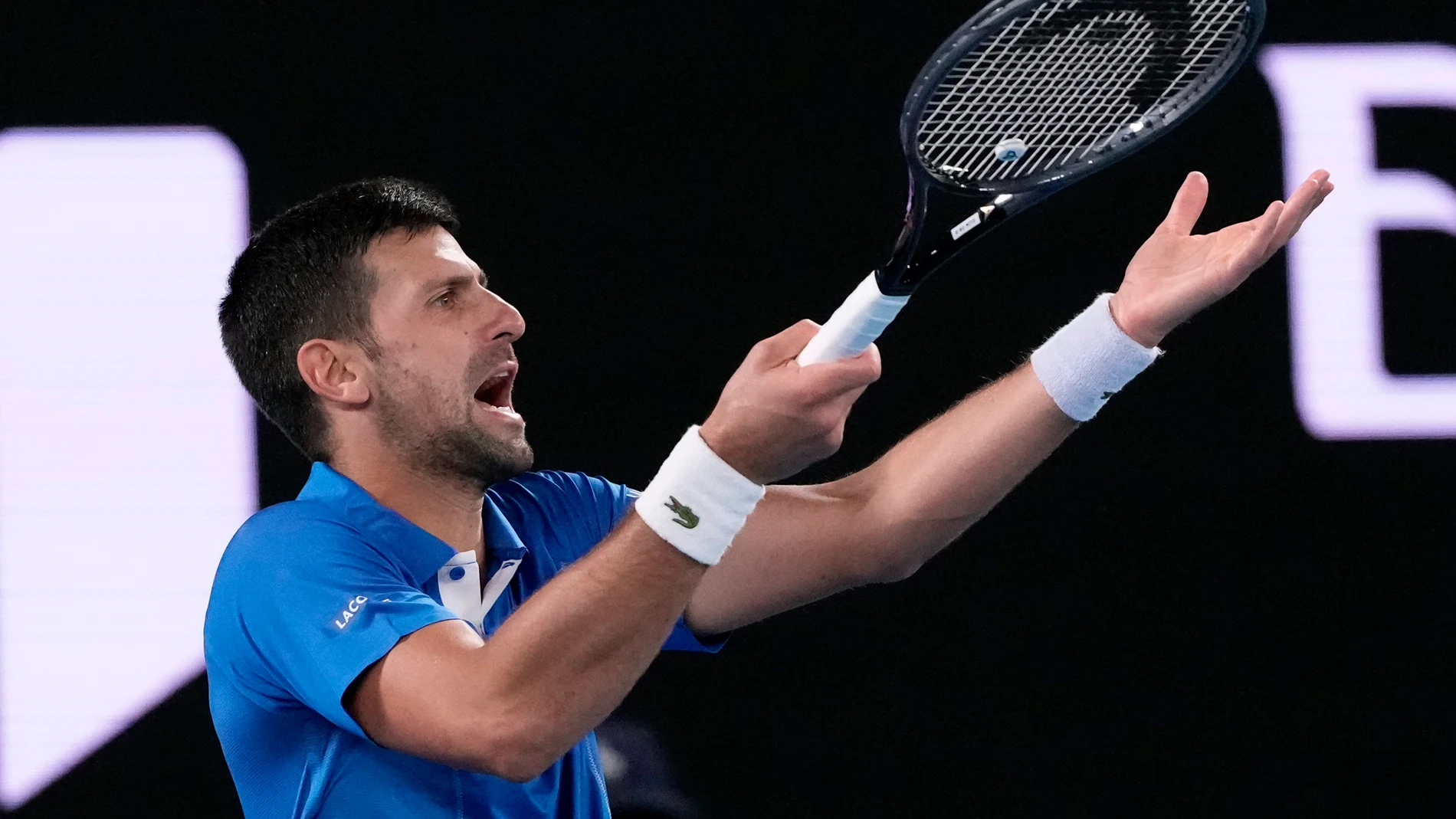 Serbia's Novak Djokovic reacts during his first round match against Croatia's Dino Prizmic at the Australian Open tennis championships at Melbourne Park, Melbourne, Australia, Sunday, Jan. 14, 2024. (AP Photo/Andy Wong)