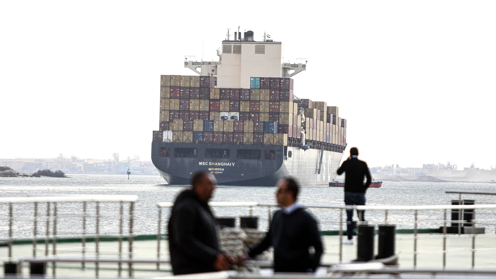 CAIRO, Jan. 13, 2024 -- A cargo ship travels on the Suez Canal in Ismailia Province, Egypt, Jan. 13, 2024. Chairman of Egypt's Suez Canal Authority (SCA) Osama Rabie said on Friday that navigation traffic in the canal is regular in both directions. In a statement, Rabie denied reports about the temporary suspension of navigation in the Suez Canal as a result of the tension in the Red Sea's strategic Bab-el-Mandeb area. 13/01/2024