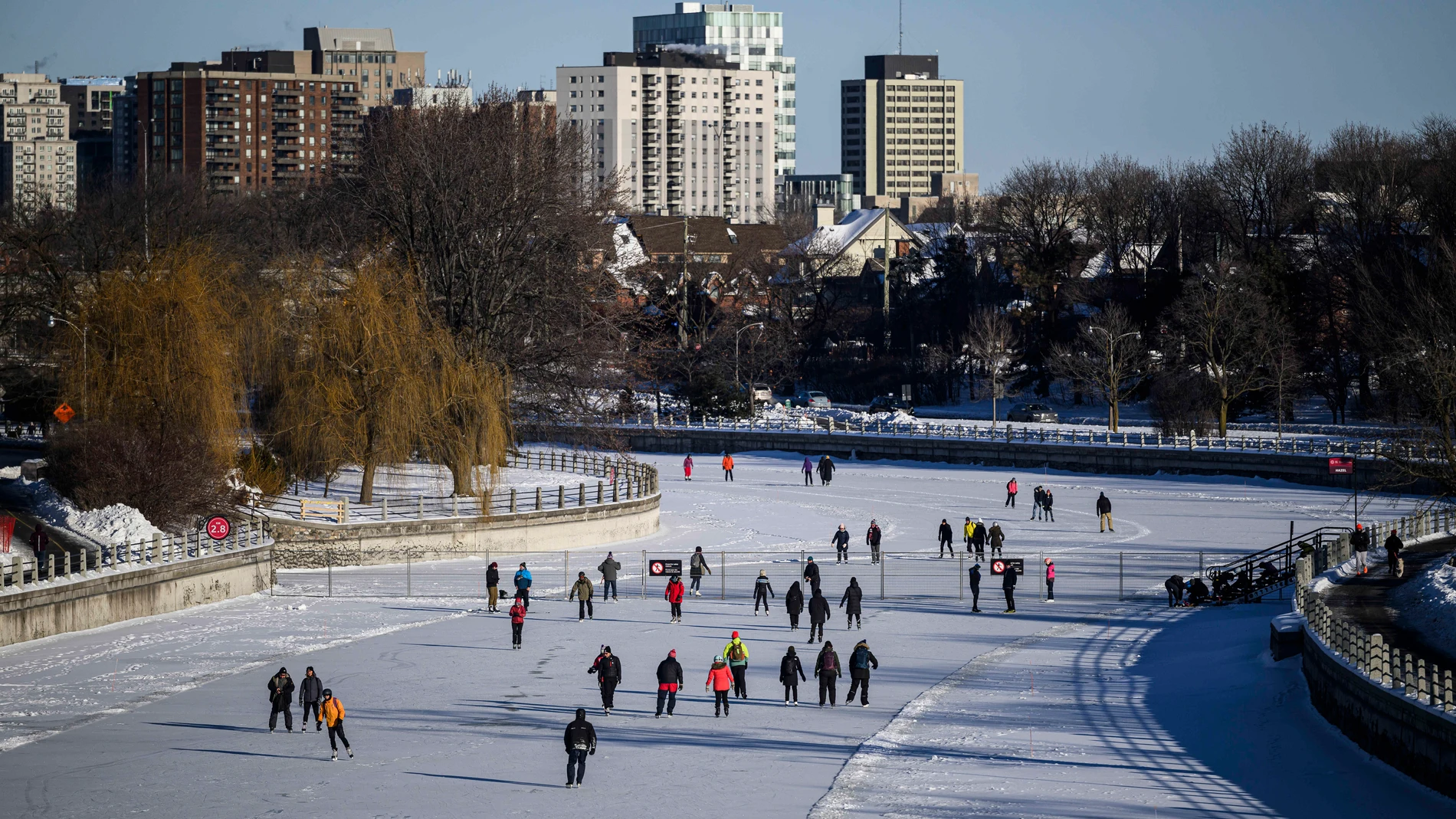 People skate on the Rideau Canal Skateway on its opening day in Ottawa, Ontario, on Sunday, Jan. 21, 2024. Skaters flocked to the ice, one year after warm and wet weather prevented the 7.8 kilometre skateway from opening for its 2023 season. (Justin Tang/The Canadian Press via AP)