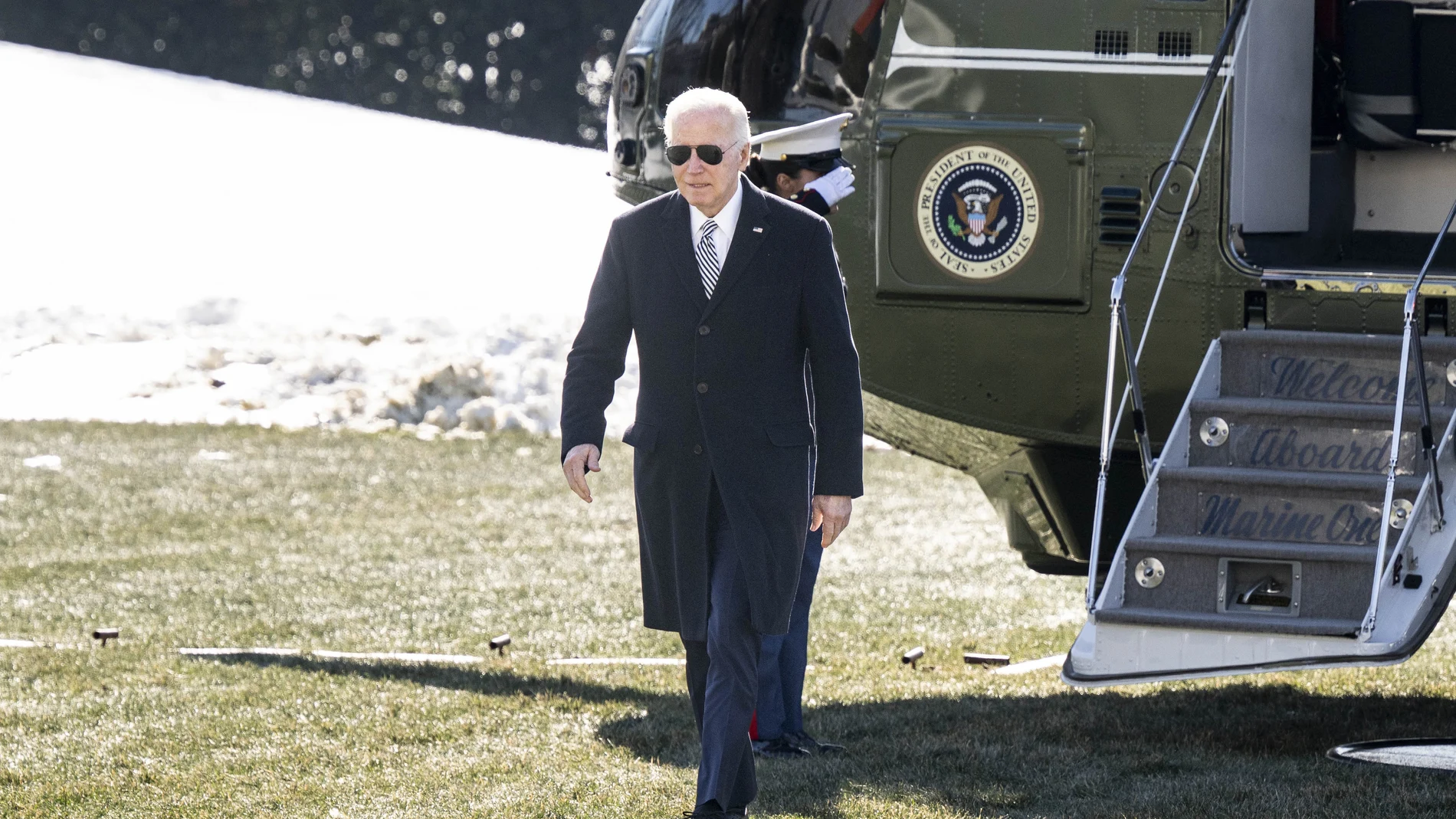 US President Joe Biden leaves Marine One as he arrives at the White House. 