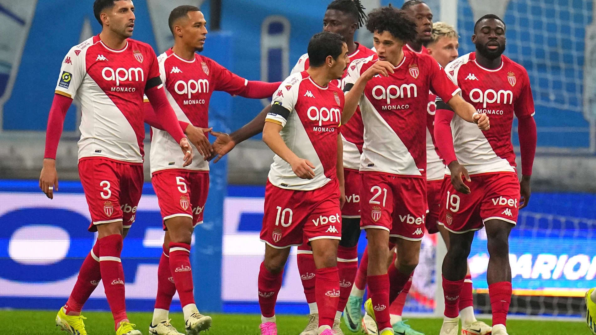 Monaco's Wissam Ben Yedder, third from left, celebrates with teammates after scoring the opening goal during the French League One soccer match between Marseille and Monaco at the Stade Velodrome in Marseille, France, Saturday, Jan. 27, 2024. (AP Photo/Daniel Cole)