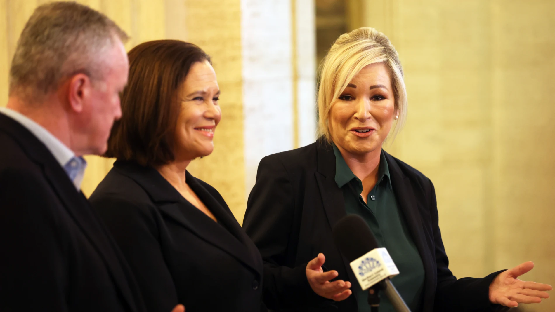 Sinn Fein's members Michelle O'Neill, right, party leader Mary Lou McDonald, centre, and Conor Murphy speak to the media at parliament buildings, Stormont, Northern Ireland, Tuesday, Jan 30, 2024. Sinn Fein's Michelle O'Neill is now Northern Ireland First Minister designate and is due to be the first Nationalist to take the position in the history of the state. (AP Photo/Peter Morrison)