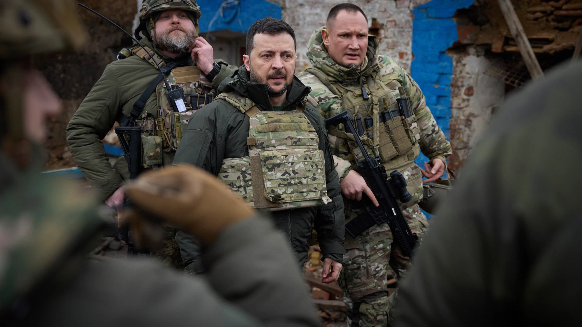 In this photo provided by the Ukrainian Presidential Press Office, Ukrainian President Volodymyr Zelenskyy, centre, during his visit to Zaporizhzhia region, the site of fierce battles with the Russian troops in Ukraine, Sunday, Feb. 4, 2024. (Ukrainian Presidential Press Office via AP)