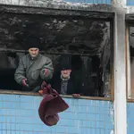 Communal workers repair damage after missile strike in Kyiv